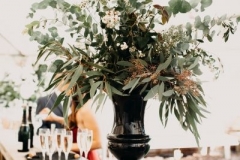Table decorations: foliage vase and candles