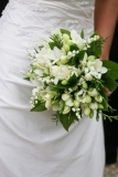 Bride's classical bouquet - white roses, lily of the valley, freesia